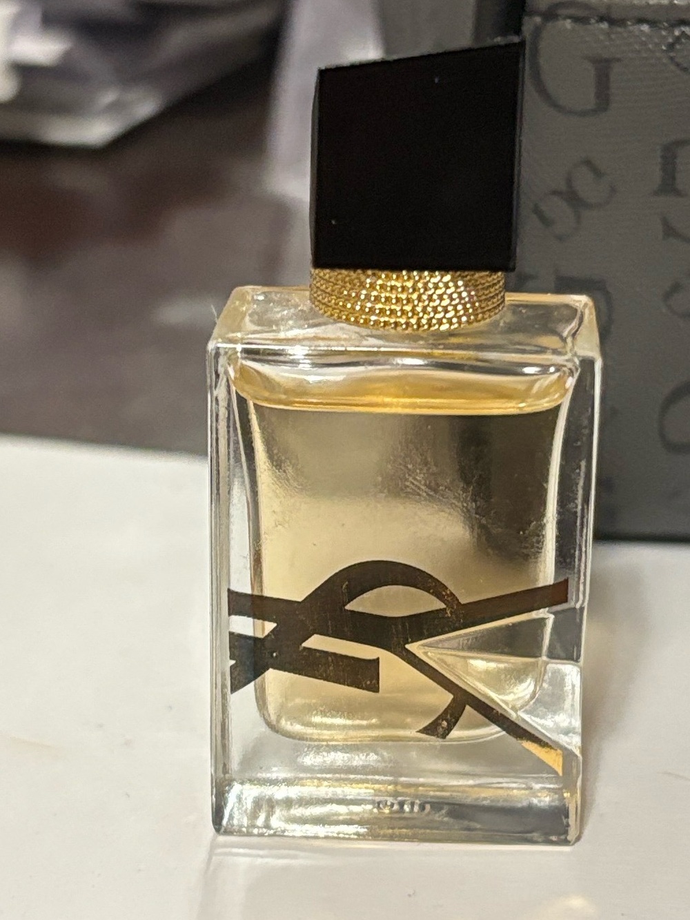 Yves Saint Laurent Glass Fragrance Bottle with Gold Liquid and Black Cap
